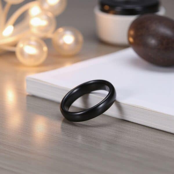 The Mountaineer 4mm black ceramic men’s wedding ring — modern domed band with custom engraving option.
