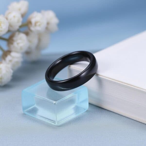 The Mountaineer black ceramic men’s wedding band — sleek 4mm domed ring with custom engraving for him.