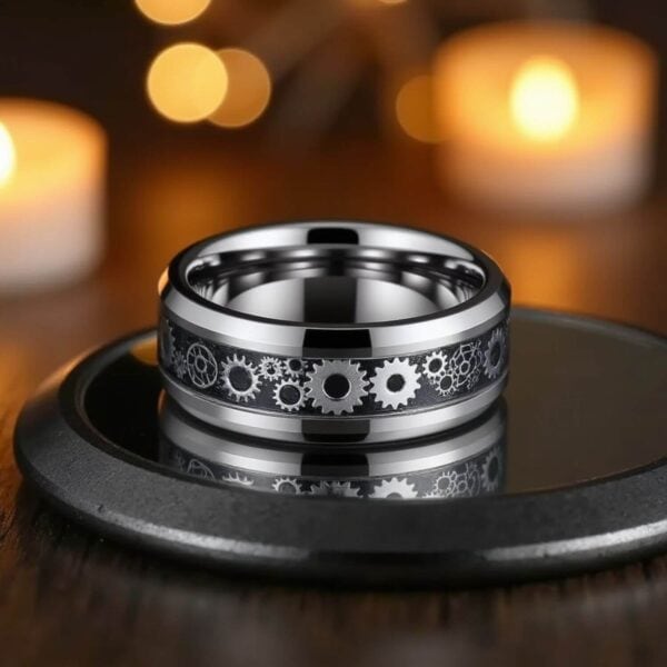Mans fashion statement ring. A silver tungsten ring with a cogwheel design inlay.