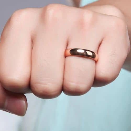 Dapper rose gold mens ring on finger