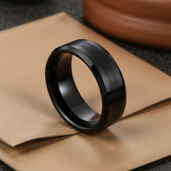 This black tungsten male ring strikes the perfect balance between modern minimalism and masculine design. Its brushed black band and polished edges make it a bold mens wedding ring or eternity band. Add a custom ring engraving for personal significance