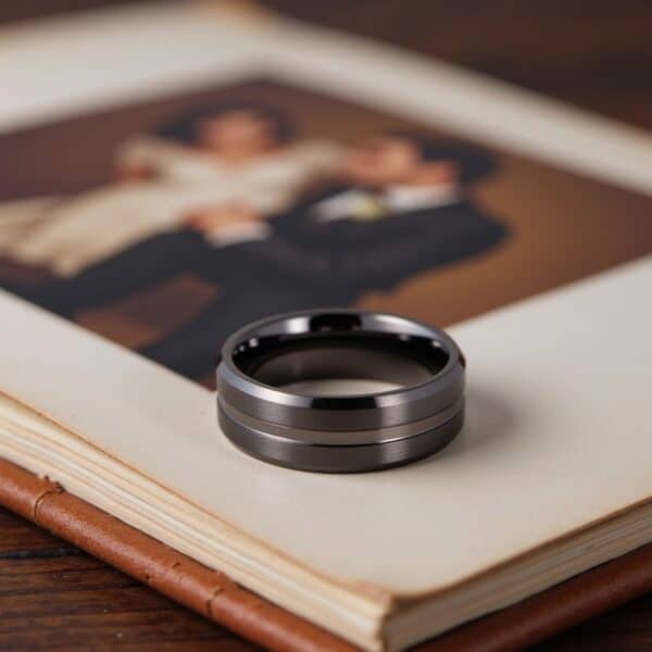 Brushed and polished tungsten men’s ring in gunmetal grey with engraving option.