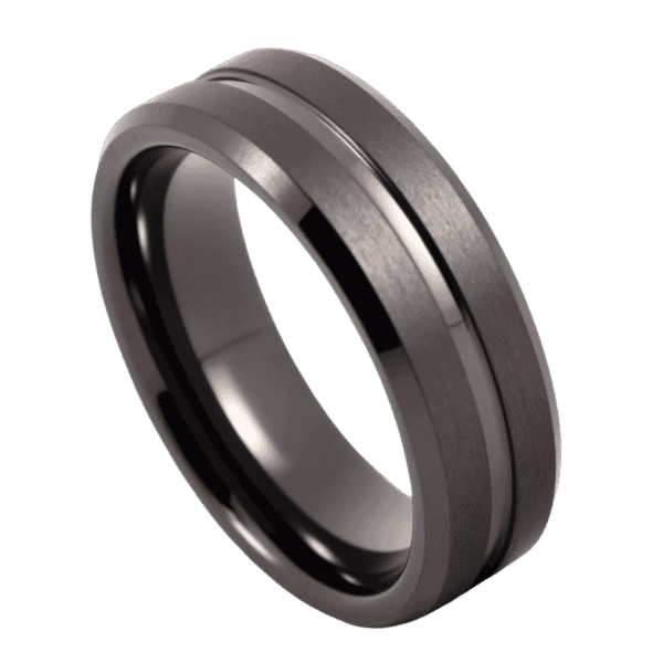 A close up of a gunmetal grey ring on a white background. Made with tungsten, the ring features two brushed sections and a smooth polished groove.