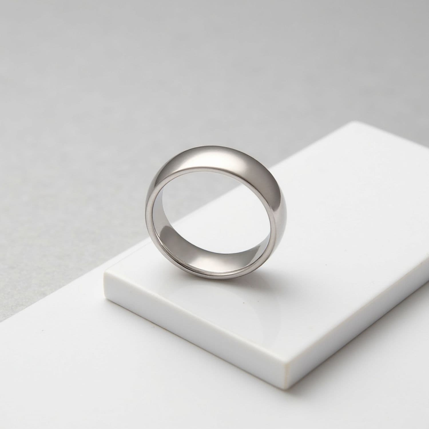 An elegant white gold tungsten ring for men. Perfectly suited as a mans fashion statement ring.