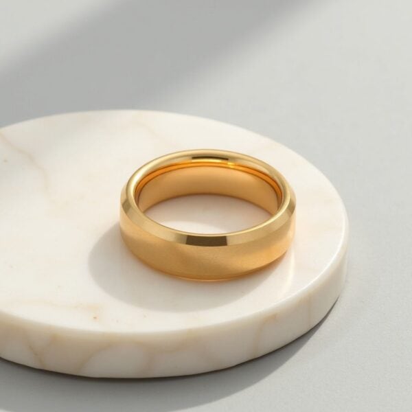 A brushed and polished mens gold ring made with tungsten. Perfect as a male engagement ring or as a mens wedding ring.