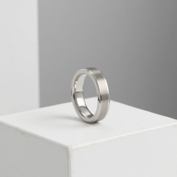 A brushed and polished white gold tungsten men’s band ideal as a wedding or eternity ring with optional engraving.