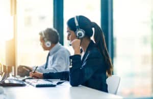 two contact center agents working