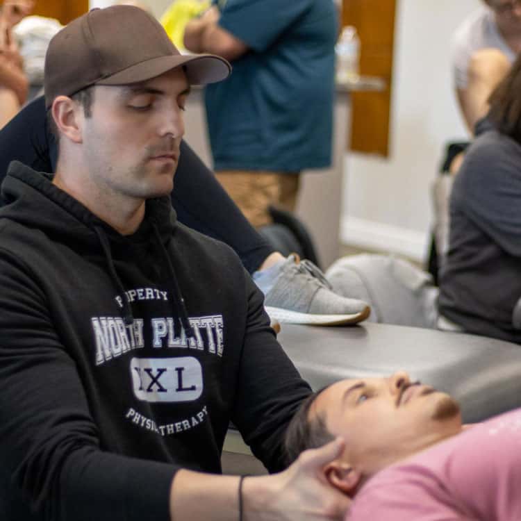 Therapist providing neck therapy to a patient at North Platte PT.