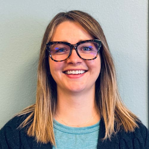 Emily Leonhardt, PTA at North Platte Physical Therapy smiling in office.
