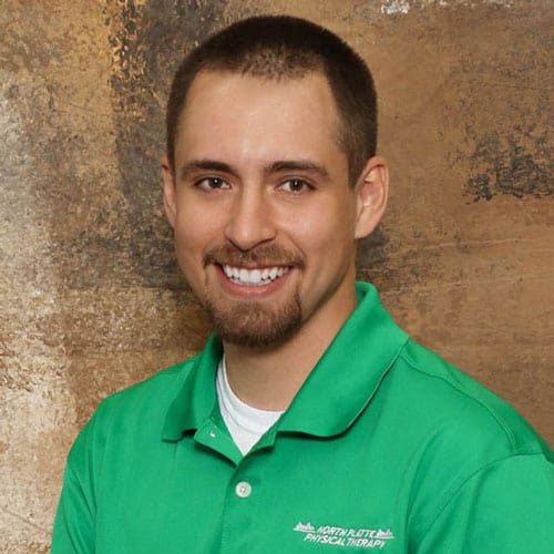 Physical therapist in green polo shirt at North Platte Physical Therapy.