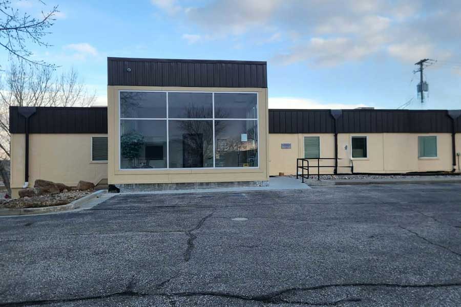 Exterior view of North Platte Physical Therapy clinic building with large glass window.