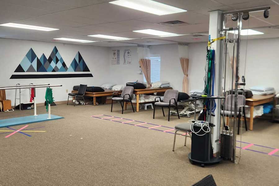 Physical therapy treatment room with equipment and therapy beds in North Platte.