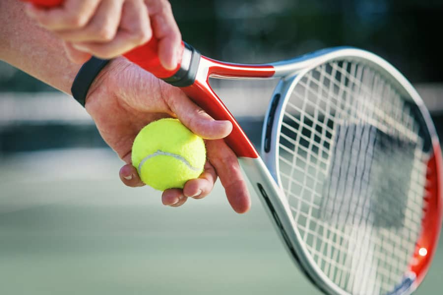Tennis racket and tennis ball for elbow pain relief at North Platte PT.
