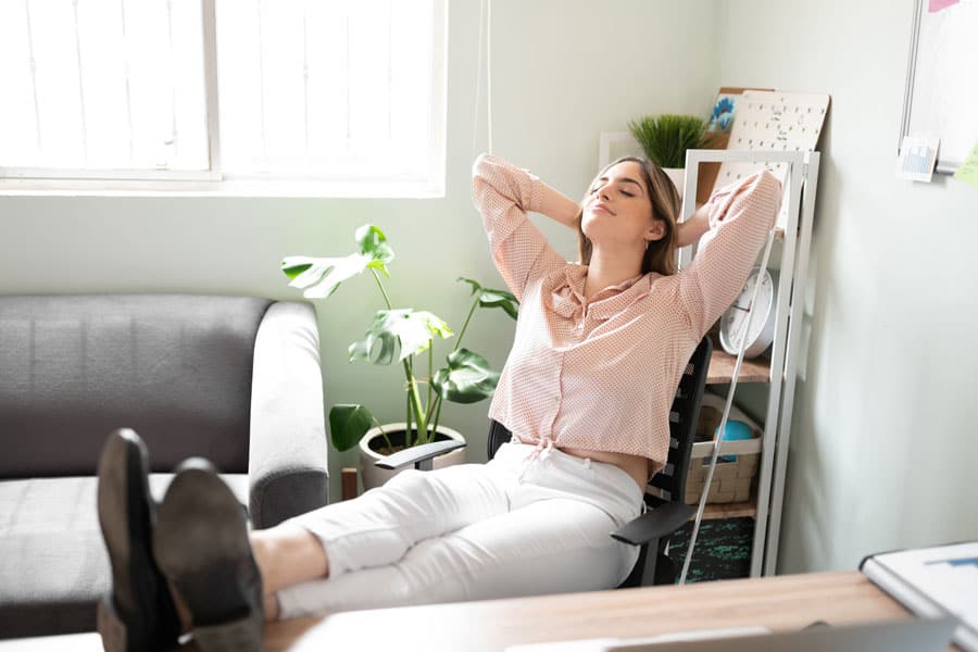 Woman relaxing after physical therapy session for headache relief.