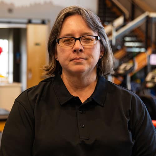 Amanda Krov, PTA at North Platte Physical Therapy in a black polo shirt.
