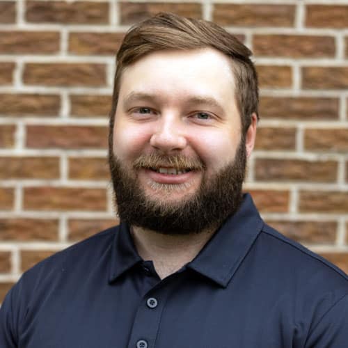 Friendly physical therapist with beard at North Platte PT clinic.