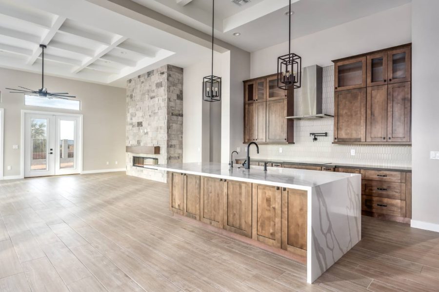 Open concept home showing kitchen flowing into living area.