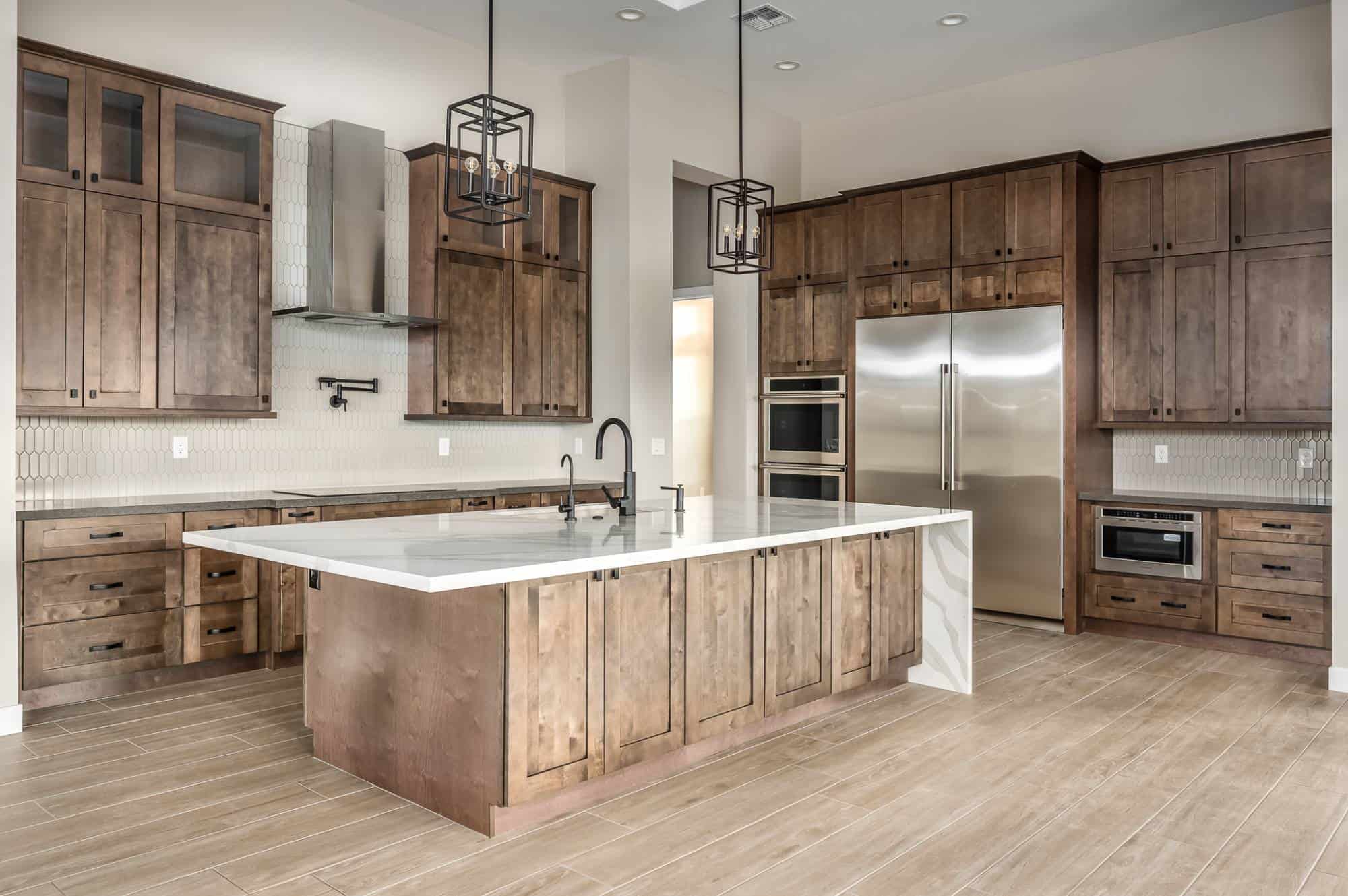 Large, rustic kitchen with wood flooring.