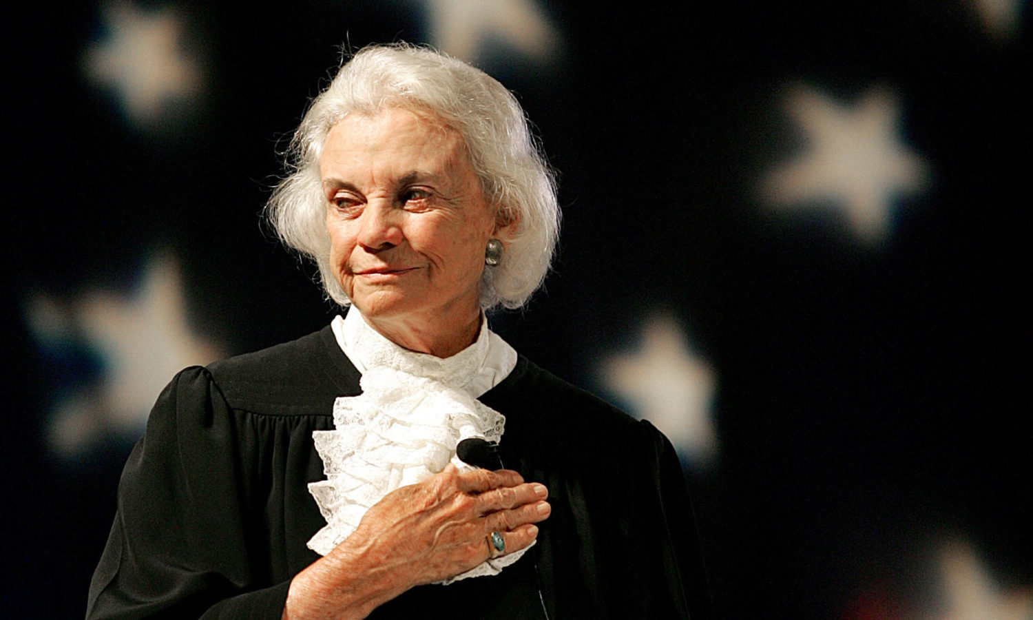 U.S. Supreme Court Justice Sandra Day O'Connor pledges alligence to the flag Saturday, Sept. 17, 2005 at an open-air Immigration and Naturalization citizenship hearing in Gilbert, Ariz. Justice O'Connor presided over the citizenship hearing where 52 nationals from 17 countries took the oath of citizenship to the United States. (AP Photo/Matt York)