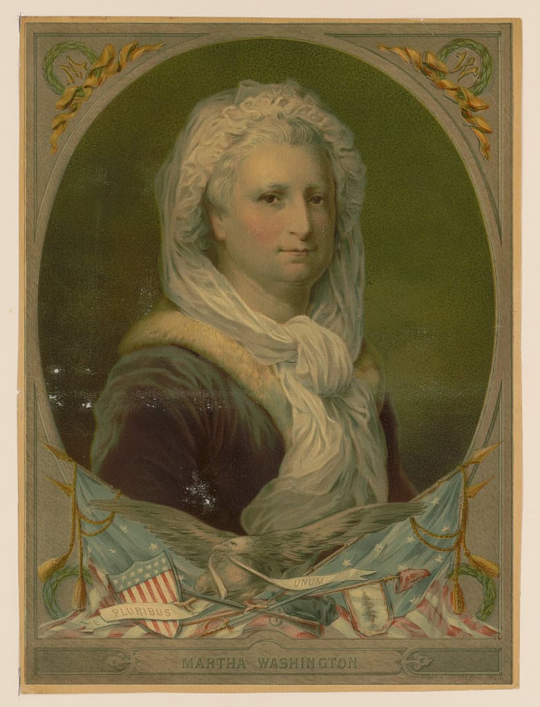 A painted portrait of Martha Washington wearing a white bonnet and shawl, set in an oval frame with decorative banners and American flags below, celebrates her legacy for Women's History Month, with her name inscribed at the bottom.