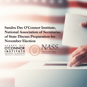 A person casts a vote into a ballot box against a backdrop of the American flag. Text reads: "Sandra Day O’Connor Institute, National Association of Secretaries of State Discuss Preparation for November Election". Logos of both organizations are displayed.