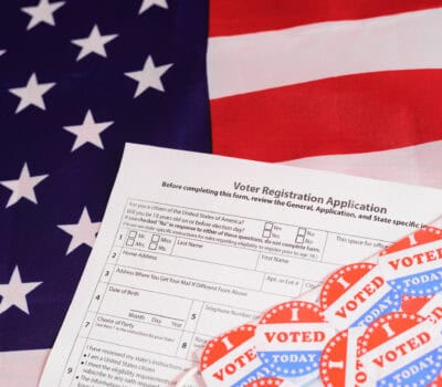 Voter registration application for the 2020 presidential elections, on an American flag background.