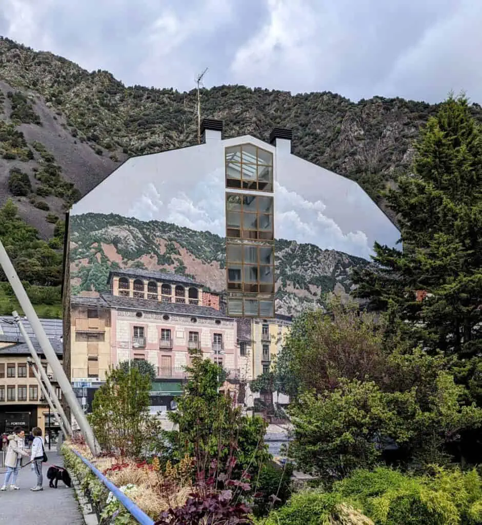 mural on the side of a building in Andorra La Vella. If you are standing in the right place, it will match up with the mountain view in the background