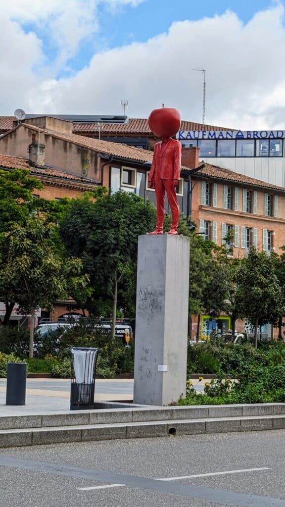 Red Apple Man -on the wide avenue between the train station and the city centre in toulouse
