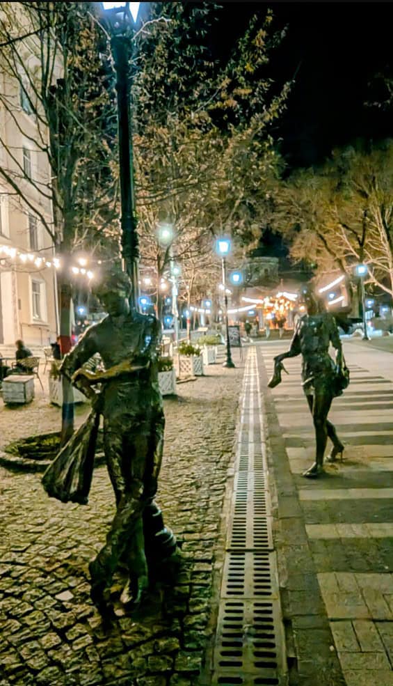 Eugen Doga chisinau street statues on cobbled street