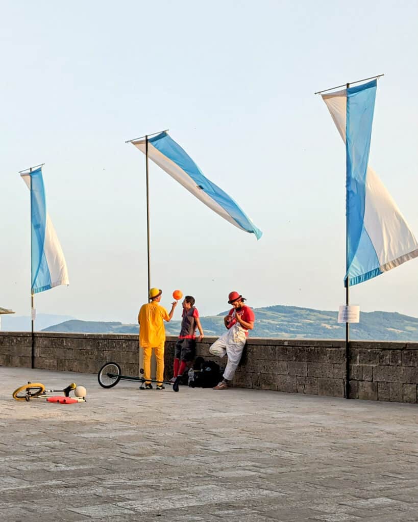 Street Performers on the ledge overlooking the view Palazza Pubblico, San Marino