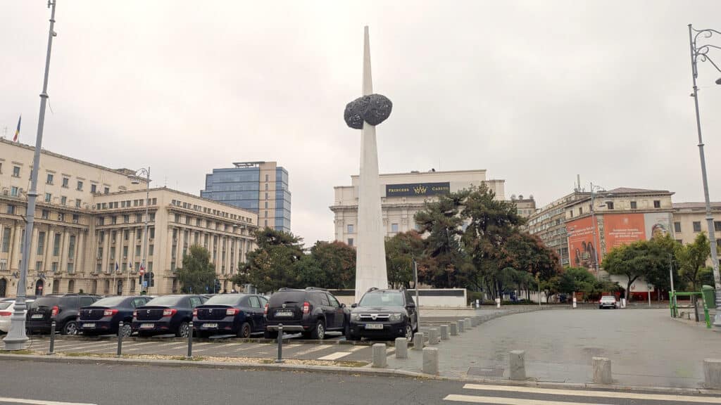 View of Revolution square, Bucharest including Rebirth Memorial - sometimes dubbed the “potato on a stick”