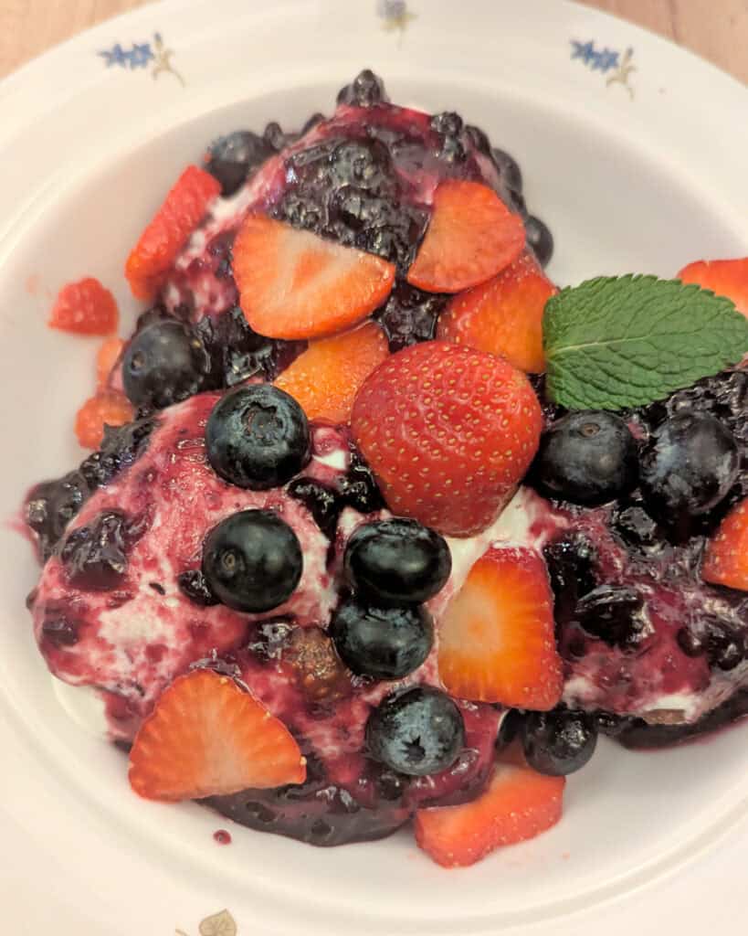 Romanian desert - Papanasi - donuts with sweet cream cheese cream and berries - Van Gogh Cafe Bucharest