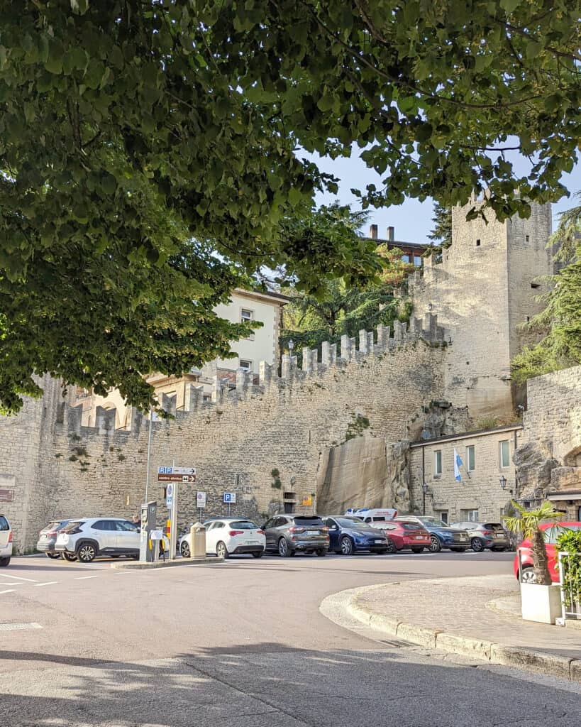 The climb to the three towers begins near Porta della Fratta, where San Marino’s old city walls rise above the lower streets