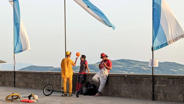 Things to do in San Marino - views of from Piazza della libertà including street performers