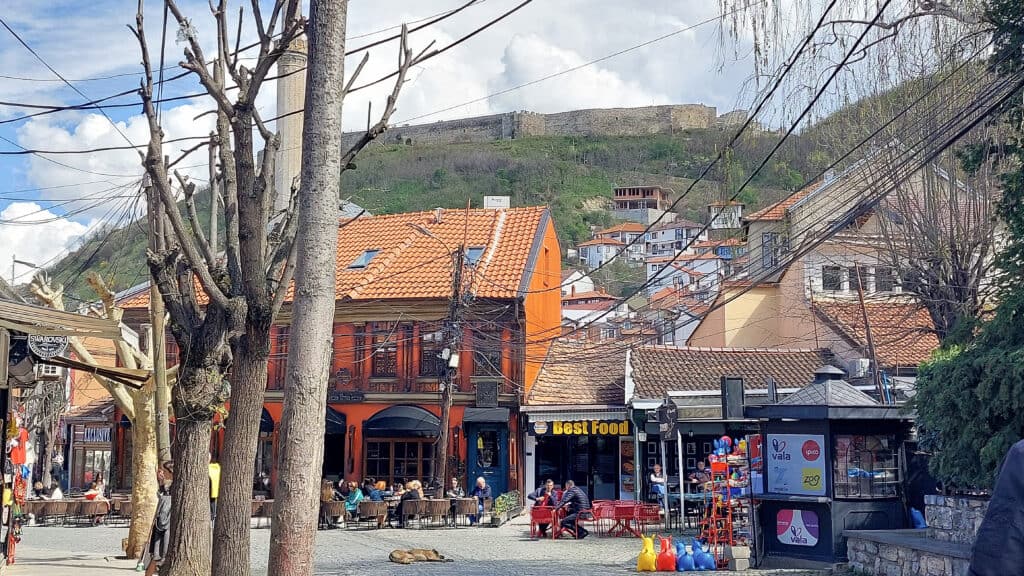 Cafes in Shadervan Square Prizren Kosovo with Prizren Fortress in the Background
