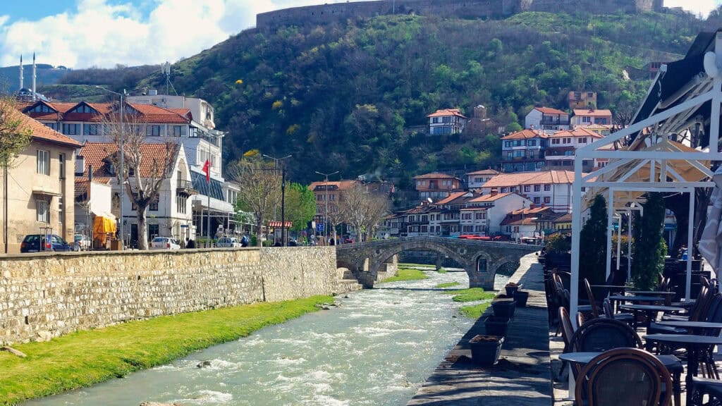 Old Bridge and River Walk in Prizren Kosovo with the Fortress in the Background. One of the things to do in Prizren