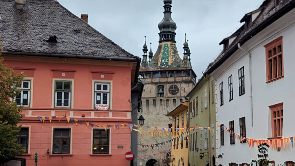 view of clock tower and vlads house in yellow Sighisoara