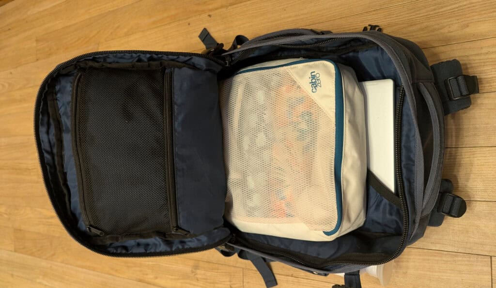 Cabin Zero Military 28L navy open displaying pockets