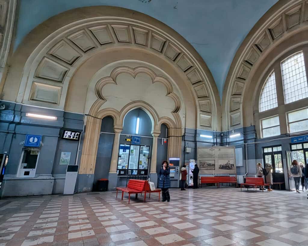 Inside Sinaia rail station - on the way to Peles Castle - beautiful arched interior,tickets can be bought at the booth with the information sign