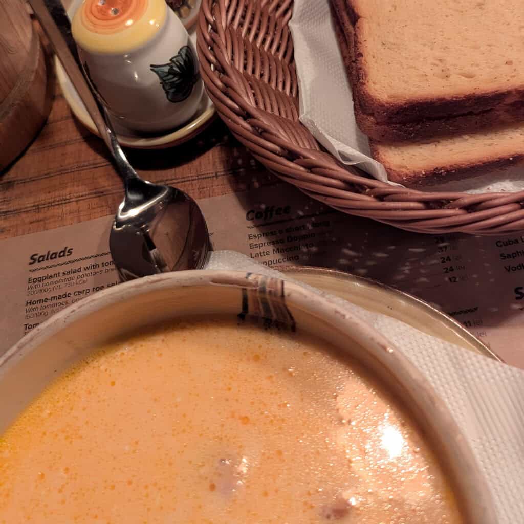 Transylvanian soup in La Ceaun - Cauldron dish Brasov