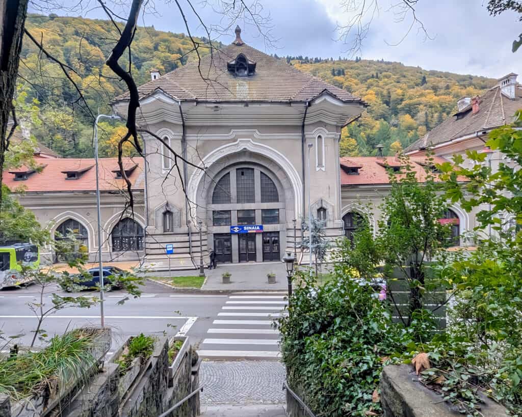 Outside Sinaia rail station for Peles Castle, Romania - view to the mountains and entrance to the train station