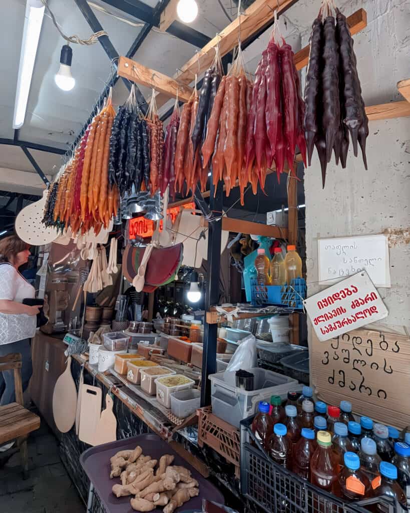 indoor market in Kutaisi with hanging churchkhela - known as Georgian candles - filled with nuts and sweets