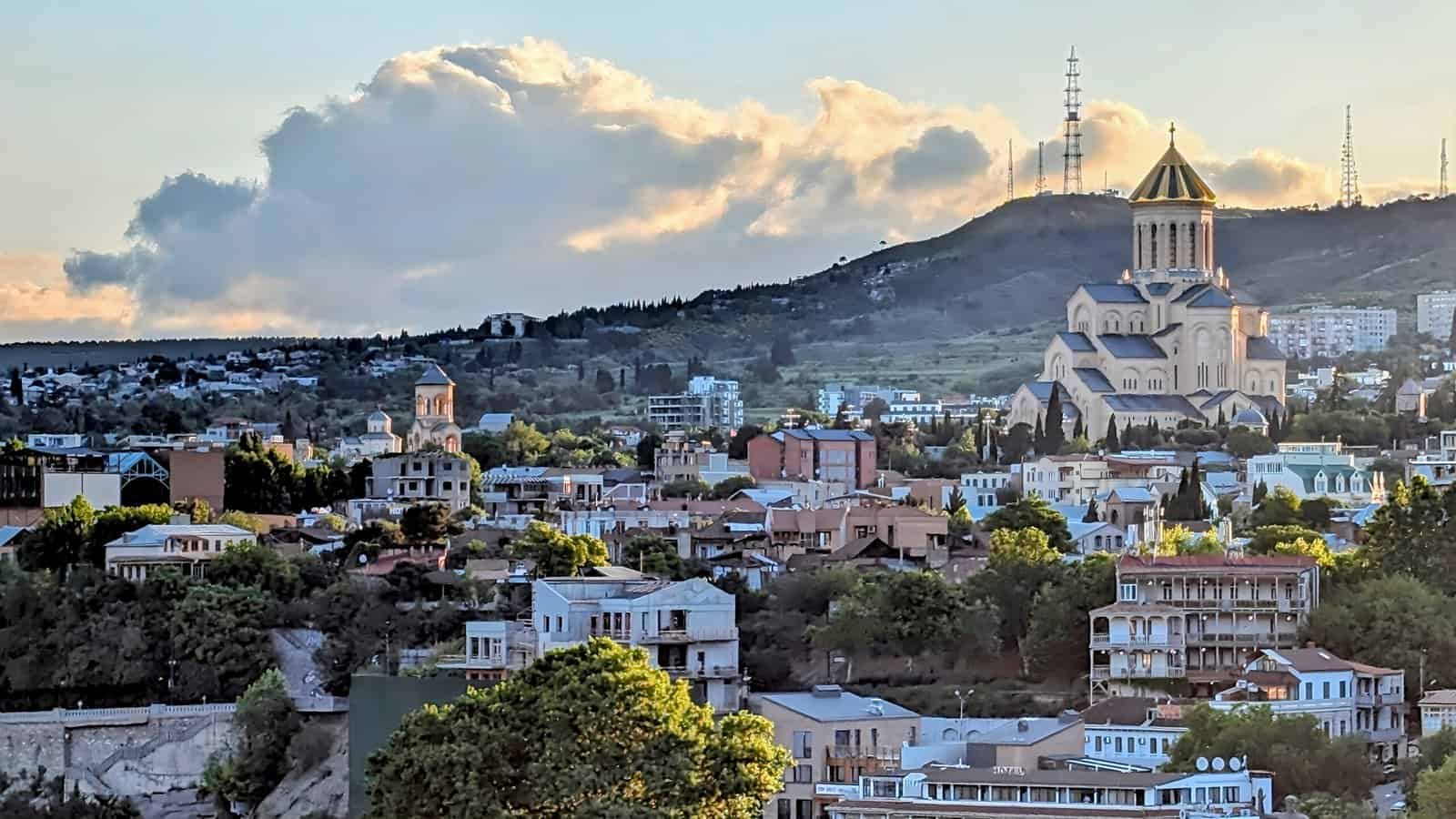 Sunrise over Tbilisi from Narikala Hill - Holy Trinity Cathedral of Tbilisi (Sameba) in prominent view