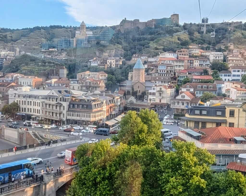 View looking back at Narikala Fortress and the Narikala Hill area of Tbilisi old town from Tbilisi Aerial Tramway (cable car)