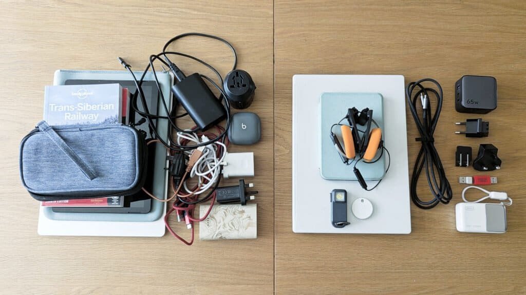 Before-and-after comparison of a 4.1kg travel tech kit and a streamlined 1.8kg ultralight travel tech setup laid out on a wooden table.