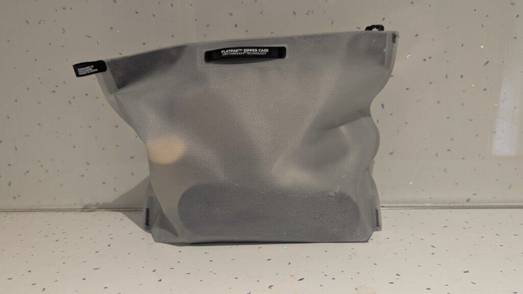 White Matador Zipper Toiletry Case on the counter - Toiletries for One Bag Travel