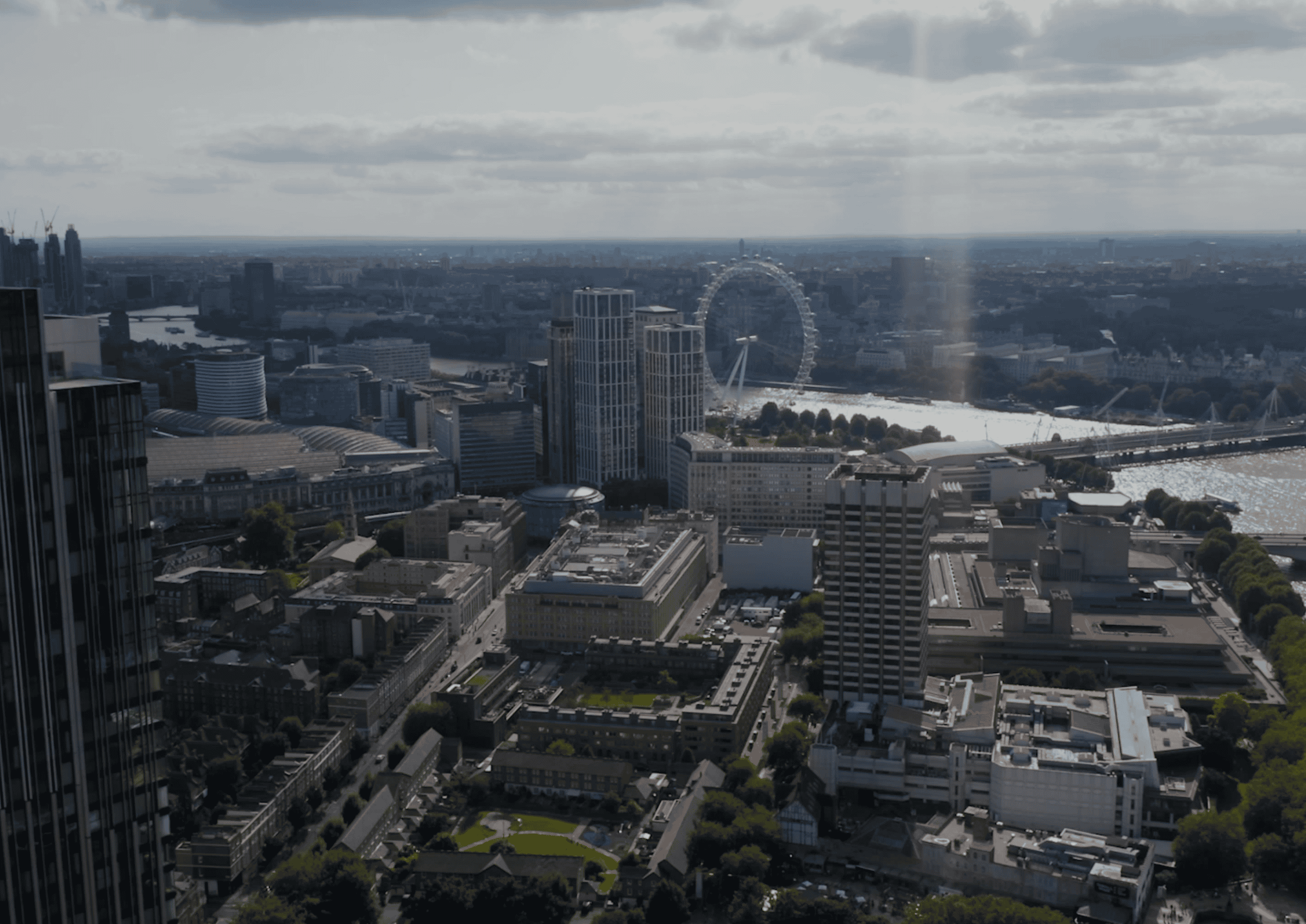 London skyline with the London Eye and Thames River from above.