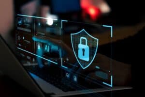 Cybersecurity digital shield with lock and AI technology icons on a laptop screen.