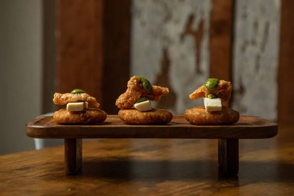 Chicharrón Arepitas at Origen Bistro: Crispy mini corn arepas with pork cracklings, a Venezuelan specialty in New Orleans.
Best restaurant in Bywater