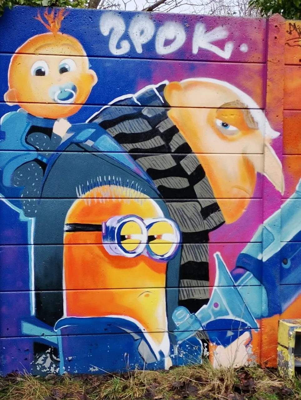 Vibrant graffiti mural featuring Minions characters and a sheep, showcasing colourful street art with playful and whimsical design elements.